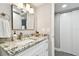 Bathroom featuring granite counters, updated fixtures and neutral paint at 211 Brandy Wine Dr # 211, Largo, FL 33771