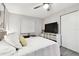Bedroom with a ceiling fan, white bedding, and closet space at 211 Brandy Wine Dr # 211, Largo, FL 33771