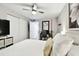 Bedroom with a ceiling fan, large closet, and adjacent desk area at 211 Brandy Wine Dr # 211, Largo, FL 33771