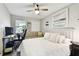 Bright bedroom features large window and bed with tufted headboard at 211 Brandy Wine Dr # 211, Largo, FL 33771