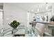 Dining area featuring a round glass table and chairs, connecting to the kitchen area at 211 Brandy Wine Dr # 211, Largo, FL 33771
