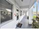 Inviting condo entrance with a modern white exterior and manicured landscaping at 211 Brandy Wine Dr # 211, Largo, FL 33771
