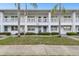 Condo building featuring neatly manicured landscaping at 211 Brandy Wine Dr # 211, Largo, FL 33771