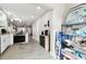 Open kitchen with tile flooring, granite countertops, stainless appliances and storage at 211 Brandy Wine Dr # 211, Largo, FL 33771