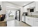 Bright kitchen area with modern appliances and white cabinets at 211 Brandy Wine Dr # 211, Largo, FL 33771