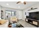 Cozy living room featuring modern decor and a flat-screen TV on a stylish media console at 211 Brandy Wine Dr # 211, Largo, FL 33771