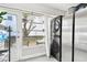 Enclosed patio with stacked washer/dryer, and backyard view at 211 Brandy Wine Dr # 211, Largo, FL 33771