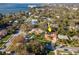 Aerial view of the home and its neighborhood, located near a scenic waterfront at 220 Garden S Cir, Dunedin, FL 34698