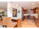 Spacious kitchen with wooden cabinets, stainless steel appliances, and barstool seating at 220 Garden S Cir, Dunedin, FL 34698