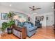 Cozy living room with hardwood floors, a comfortable sofa, and stylish decor and accessories at 220 Garden S Cir, Dunedin, FL 34698