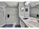 Bright bathroom featuring a glass-enclosed shower and double vanity sinks at 2343 Hidden Trail Dr, Spring Hill, FL 34606
