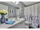 Bathroom featuring a stylish shower curtain, decorative vase, and modern sink at 2343 Hidden Trail Dr, Spring Hill, FL 34606