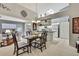 Bright dining area with a view of the living room and outdoor patio at 2343 Hidden Trail Dr, Spring Hill, FL 34606