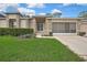 Charming single-story home with brick accents, well-manicured lawn, and inviting entrance at 2343 Hidden Trail Dr, Spring Hill, FL 34606