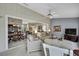 Open floor plan living room features neutral color palette, ceiling fan and backyard access at 2343 Hidden Trail Dr, Spring Hill, FL 34606