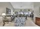 Bright living room featuring high ceilings, neutral tones, comfortable seating, and lots of natural light at 2343 Hidden Trail Dr, Spring Hill, FL 34606
