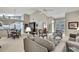 Open concept living space with a dining area, comfortable seating, and ample natural light at 2343 Hidden Trail Dr, Spring Hill, FL 34606