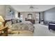 Comfortable primary bedroom boasts natural light, plush carpeting, and work space at 2343 Hidden Trail Dr, Spring Hill, FL 34606