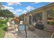 Cozy brick patio with comfortable seating, ideal for outdoor entertaining and relaxation at 2343 Hidden Trail Dr, Spring Hill, FL 34606
