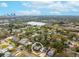 Aerial view of a residential neighborhood featuring a lake and skyline in the distance with the home circled at 2454 15Th N Ave, St Petersburg, FL 33713