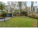 Large backyard with a shed, pergola, and a fire pit area, providing ample space for outdoor activities at 2454 15Th N Ave, St Petersburg, FL 33713