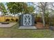 Backyard shed with a gray exterior, white trim, and a stone paver walkway at 2454 15Th N Ave, St Petersburg, FL 33713