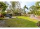 The backyard features a shed, a wood pergola, a fire pit and stone landscape features. The yard is enclosed by a wood fence at 2454 15Th N Ave, St Petersburg, FL 33713