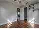 Bedroom featuring hardwood floors, a ceiling fan, storage shelves and a closet at 2454 15Th N Ave, St Petersburg, FL 33713