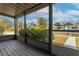 Screened front porch featuring a seating area and view of the landscaped front yard at 2454 15Th N Ave, St Petersburg, FL 33713