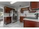 Well-equipped kitchen boasts dark wood cabinets, stainless appliances and stylish countertops at 2454 15Th N Ave, St Petersburg, FL 33713