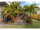 Private backyard outdoor shower features lush tropical landscaping and a wood privacy screen at 2454 15Th N Ave, St Petersburg, FL 33713
