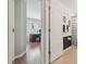 Neat bathroom with an adjoining view of a bedroom and wood floors at 31101 Wrencrest Dr, Wesley Chapel, FL 33543