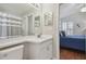 Bathroom and bedroom with neutral decor, great natural light, and tile floor at 31101 Wrencrest Dr, Wesley Chapel, FL 33543