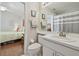 Bathroom and bedroom with neutral decor, great natural light, and tile floor at 31101 Wrencrest Dr, Wesley Chapel, FL 33543