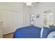 Bedroom with a view of bathroom, white walls, wood floors, and closet at 31101 Wrencrest Dr, Wesley Chapel, FL 33543