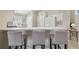 Inviting kitchen with breakfast bar seating, white cabinets, and tile flooring for easy maintenance at 31101 Wrencrest Dr, Wesley Chapel, FL 33543