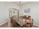 Spacious dining room perfect for Gathering gatherings with an archway and wooden furniture at 31101 Wrencrest Dr, Wesley Chapel, FL 33543