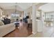 Open-concept living area with views to the kitchen and dining space, great for entertaining at 31101 Wrencrest Dr, Wesley Chapel, FL 33543