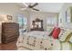 Comfortable main bedroom with ensuite bathroom access and view of the backyard at 31101 Wrencrest Dr, Wesley Chapel, FL 33543