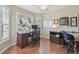 Home office with hardwood floors, recessed lighting and a large window for ample natural light at 31101 Wrencrest Dr, Wesley Chapel, FL 33543