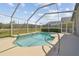 Screened pool with lake view and ample decking at 31101 Wrencrest Dr, Wesley Chapel, FL 33543