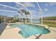 Beautiful screened-in pool with a serene lake view, perfect for outdoor enjoyment and relaxation at 31101 Wrencrest Dr, Wesley Chapel, FL 33543