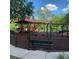 A lovely community playground featuring swings, slides, and a shaded seating area at 31229 Claridge Pl, Wesley Chapel, FL 33543