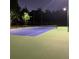 Well-lit tennis court for an evening match at 31229 Claridge Pl, Wesley Chapel, FL 33543