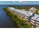 Waterfront condo complex with a metal roof, offering beautiful views and a serene coastal lifestyle at 3230 Mangrove Point Dr, Ruskin, FL 33570