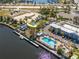 Aerial shot of Sunset Bar & Grill with a pool, docks, and a marina in the background at 3230 Mangrove Point Dr, Ruskin, FL 33570