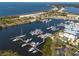 Breathtaking aerial view of a marina, beach, and waterfront property perfect for boating and leisure at 3230 Mangrove Point Dr, Ruskin, FL 33570