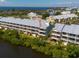 Beautiful condo complex near the water, features a metal roof and multiple balconies for stunning views at 3230 Mangrove Point Dr, Ruskin, FL 33570