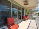 Relaxing balcony space furnished with comfortable seating, offering serene views of the surrounding landscape at 3230 Mangrove Point Dr, Ruskin, FL 33570