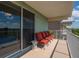 Cozy balcony with outdoor seating, ideal for enjoying the view and fresh air at 3230 Mangrove Point Dr, Ruskin, FL 33570